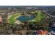 Golf course with pond and fountain, surrounded by homes at 13235 Legends Trl, Dade City, FL 33525