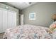 Bedroom with a full-size bed and access to another room at 13235 Legends Trl, Dade City, FL 33525