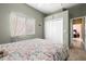 Bedroom with a full-size bed and double door closet at 13235 Legends Trl, Dade City, FL 33525
