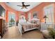 Bright bedroom with a queen-size bed and access to a pool view at 13235 Legends Trl, Dade City, FL 33525