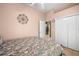 Bedroom with a queen-size bed, and access to a nearby kitchen at 13235 Legends Trl, Dade City, FL 33525