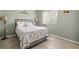 Bedroom with a full-size bed and light-colored walls at 13235 Legends Trl, Dade City, FL 33525