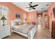 Bedroom with a queen-size bed and access to the bathroom at 13235 Legends Trl, Dade City, FL 33525