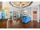 Spacious living area featuring hardwood floors and ample natural light at 13235 Legends Trl, Dade City, FL 33525