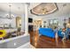 Bright living room with hardwood floors, fireplace, and comfortable seating at 13235 Legends Trl, Dade City, FL 33525