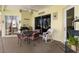 Covered patio with table, chairs, and rocking chair at 13235 Legends Trl, Dade City, FL 33525