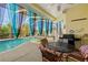 Relaxing pool area with patio furniture and grill at 13235 Legends Trl, Dade City, FL 33525