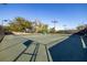 Well-lit tennis courts at 13235 Legends Trl, Dade City, FL 33525