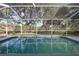 Inviting screened pool with tranquil backyard views at 8835 Thoreau Pl, Hudson, FL 34667