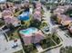 Community pool and surrounding buildings aerial view at 1545 Citrine Trl, Tarpon Springs, FL 34689