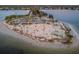 Island beach with pavilion and parking; aerial view at 1545 Citrine Trl, Tarpon Springs, FL 34689