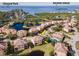 Aerial view of waterfront community with luxurious homes and private pools at 1545 Citrine Trl, Tarpon Springs, FL 34689