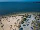 Aerial view of beach, parking lot, and palm trees at 1545 Citrine Trl, Tarpon Springs, FL 34689