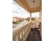 Private balcony overlooking community with seating for relaxing at 1545 Citrine Trl, Tarpon Springs, FL 34689