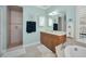 Bathroom with shower, vanity, and separate tub at 1545 Citrine Trl, Tarpon Springs, FL 34689