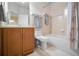 Clean bathroom with tub, toilet and vanity at 1545 Citrine Trl, Tarpon Springs, FL 34689