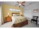Bright bedroom with double bed, nightstands, and built-in drawers at 1545 Citrine Trl, Tarpon Springs, FL 34689