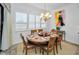 Elegant dining room features a round table, six chairs, and plantation shutters at 1545 Citrine Trl, Tarpon Springs, FL 34689