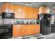 Garage with kitchenette featuring cabinets and appliances at 1545 Citrine Trl, Tarpon Springs, FL 34689