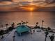 Beachfront gazebo at sunset with people enjoying the view at 1545 Citrine Trl, Tarpon Springs, FL 34689
