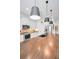 Modern kitchen with a large island and pendant lighting at 1545 Citrine Trl, Tarpon Springs, FL 34689