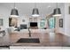 Kitchen island with a farmhouse sink overlooking the living room at 1545 Citrine Trl, Tarpon Springs, FL 34689