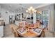 Open concept kitchen with island, stainless steel appliances, and stylish pendant lighting at 1545 Citrine Trl, Tarpon Springs, FL 34689