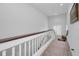 Upper level hallway with a view of the lower level at 1545 Citrine Trl, Tarpon Springs, FL 34689