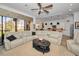 Open living room showcasing a spacious layout, large sectional sofa, and an open kitchen view at 1545 Citrine Trl, Tarpon Springs, FL 34689