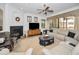 Living room features a fireplace, large sectional sofa and built-in entertainment center at 1545 Citrine Trl, Tarpon Springs, FL 34689