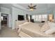 Main bedroom with king bed, private access to the bathroom, and plenty of natural light at 1545 Citrine Trl, Tarpon Springs, FL 34689