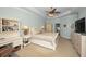 Spacious main bedroom with a king-size bed and built-in shelving at 1545 Citrine Trl, Tarpon Springs, FL 34689
