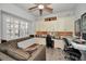 Home office with built-in cabinetry, window seat, and comfortable seating at 1545 Citrine Trl, Tarpon Springs, FL 34689