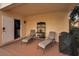 Relaxing patio with lounge chairs and grill at 1545 Citrine Trl, Tarpon Springs, FL 34689