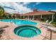 Resort-style pool and spa with lounge chairs at 1545 Citrine Trl, Tarpon Springs, FL 34689
