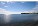 Waterfront view of a calm sea with a small island in the distance at 1545 Citrine Trl, Tarpon Springs, FL 34689