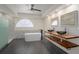 Spa-like bathroom with marble accents, double sinks, and soaking tub at 15806 Adobe Dr, Hudson, FL 34667