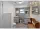 Updated bathroom with mosaic tile, double vanity, and gray cabinets at 15806 Adobe Dr, Hudson, FL 34667