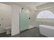Bathroom with a large walk in shower and free standing tub at 15806 Adobe Dr, Hudson, FL 34667