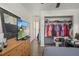 Bedroom with dresser, large closet, and flat-screen TV at 15806 Adobe Dr, Hudson, FL 34667