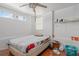 Simple bedroom with a double bed and ceiling fan at 15806 Adobe Dr, Hudson, FL 34667