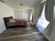 Spacious bedroom with wood-look floors and double closets at 15806 Adobe Dr, Hudson, FL 34667