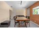 Casual dining area with a wood table, six chairs and a sofa at 15806 Adobe Dr, Hudson, FL 34667