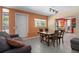 Dining area with a wood table, chairs, and a sofa at 15806 Adobe Dr, Hudson, FL 34667