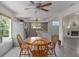 Dining area with wood table and chairs near kitchen at 15806 Adobe Dr, Hudson, FL 34667