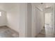 Clean hallway with light grey vinyl flooring and doors to other rooms at 15806 Adobe Dr, Hudson, FL 34667