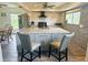 Modern kitchen featuring a large island and stainless steel appliances at 15806 Adobe Dr, Hudson, FL 34667