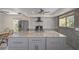 Renovated kitchen, granite countertops, gray cabinets at 15806 Adobe Dr, Hudson, FL 34667
