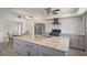 Updated kitchen with granite countertops and gray cabinets at 15806 Adobe Dr, Hudson, FL 34667