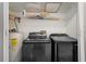 Laundry room with washer, dryer, and shelving for storage at 15806 Adobe Dr, Hudson, FL 34667